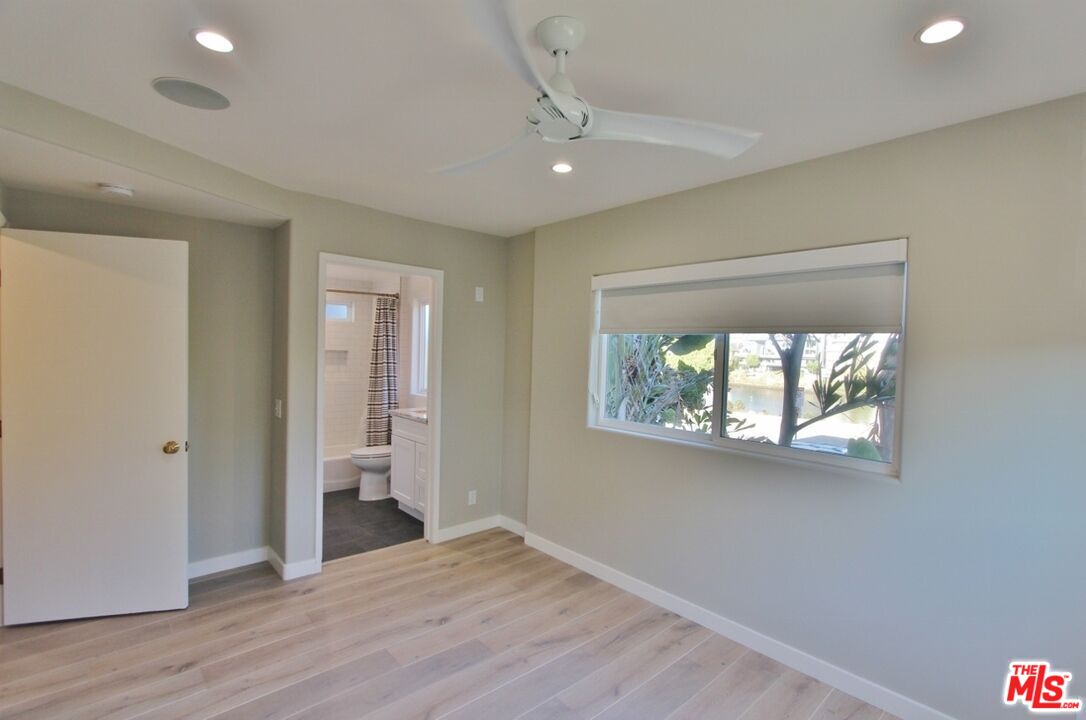 6521 Pacific Avenue Playa del Rey, CA 90293 - Photo 35 of 42 an empty room with wooden floor and windows