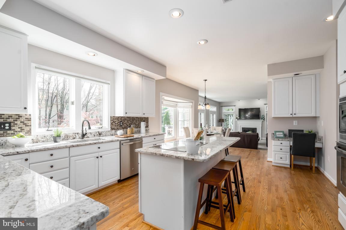 12907 Hedgetop Drive Herndon, VA 20171 - Photo 17 of 60 Granite island with induction cooktop