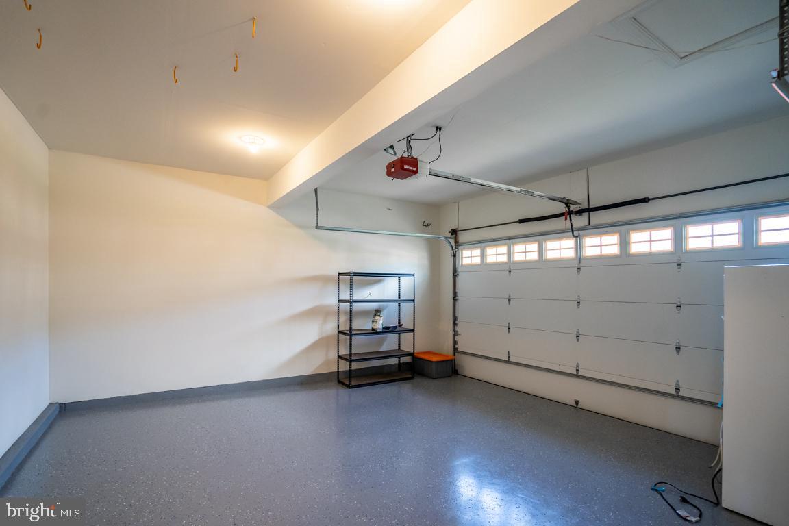 12907 Hedgetop Drive Herndon, VA 20171 - Photo 47 of 60 2-car garage with high ceilings and epoxy floor