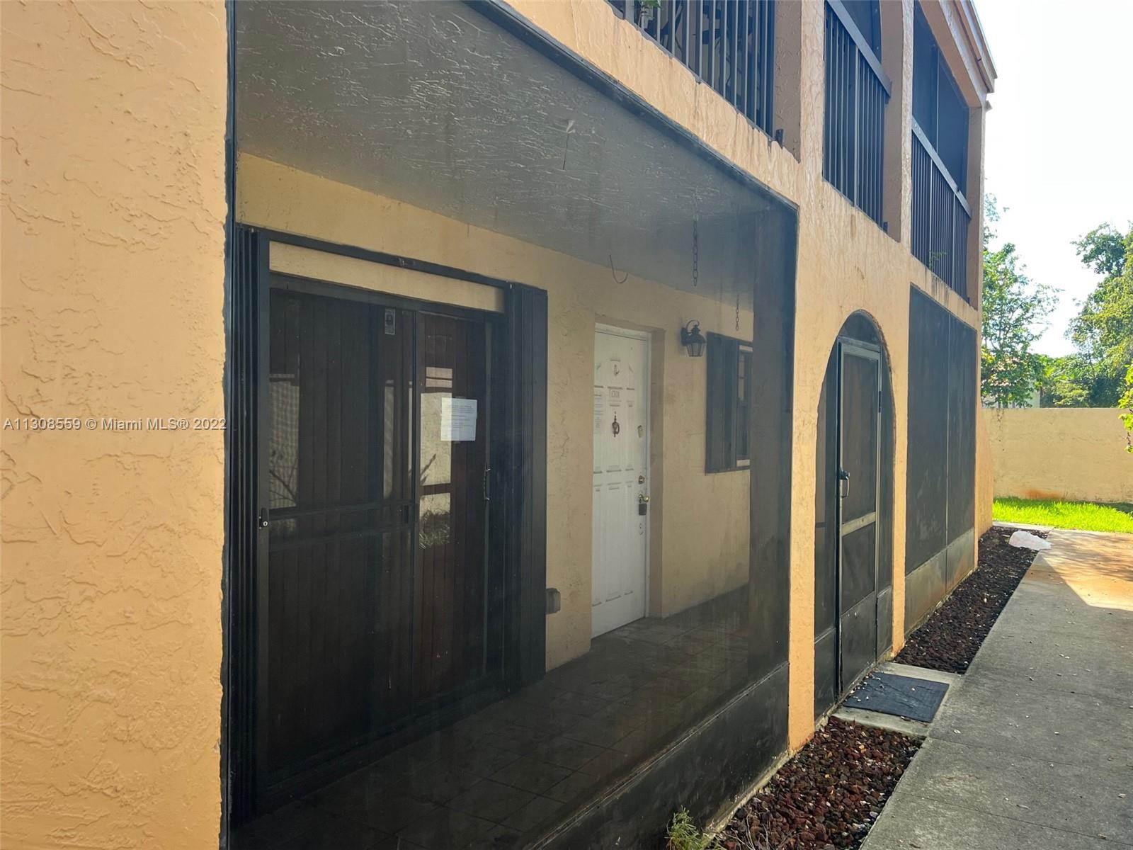 18230 Mediterranean Boulevard, Unit 113 Hialeah, FL 33015 - Photo 3 of 18 a view of a bathroom with a shower