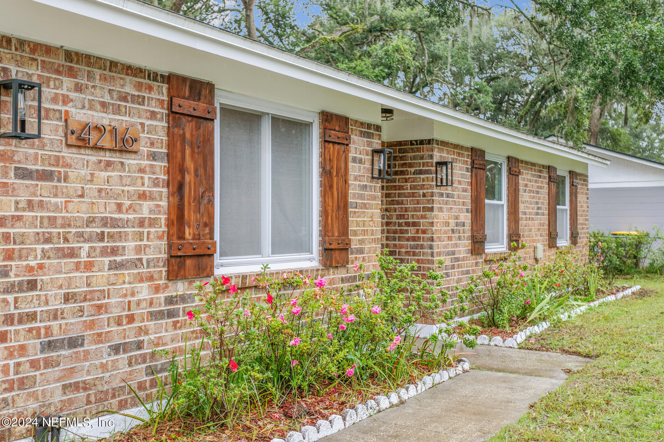 4216 Oriely Drive Jacksonville, FL 32210 - Photo 12 of 36 a front view of a house with plants