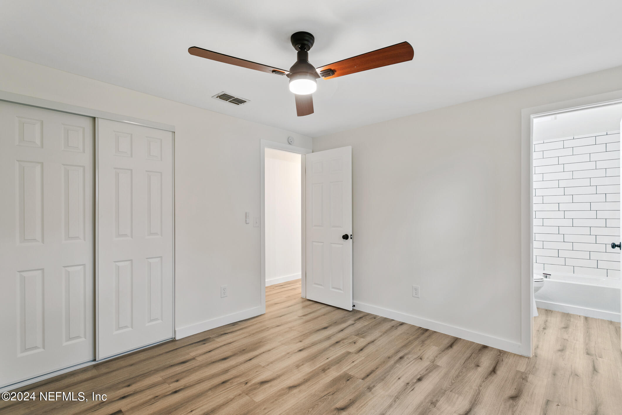 4216 Oriely Drive Jacksonville, FL 32210 - Photo 23 of 36 a view of an entryway with wooden floor