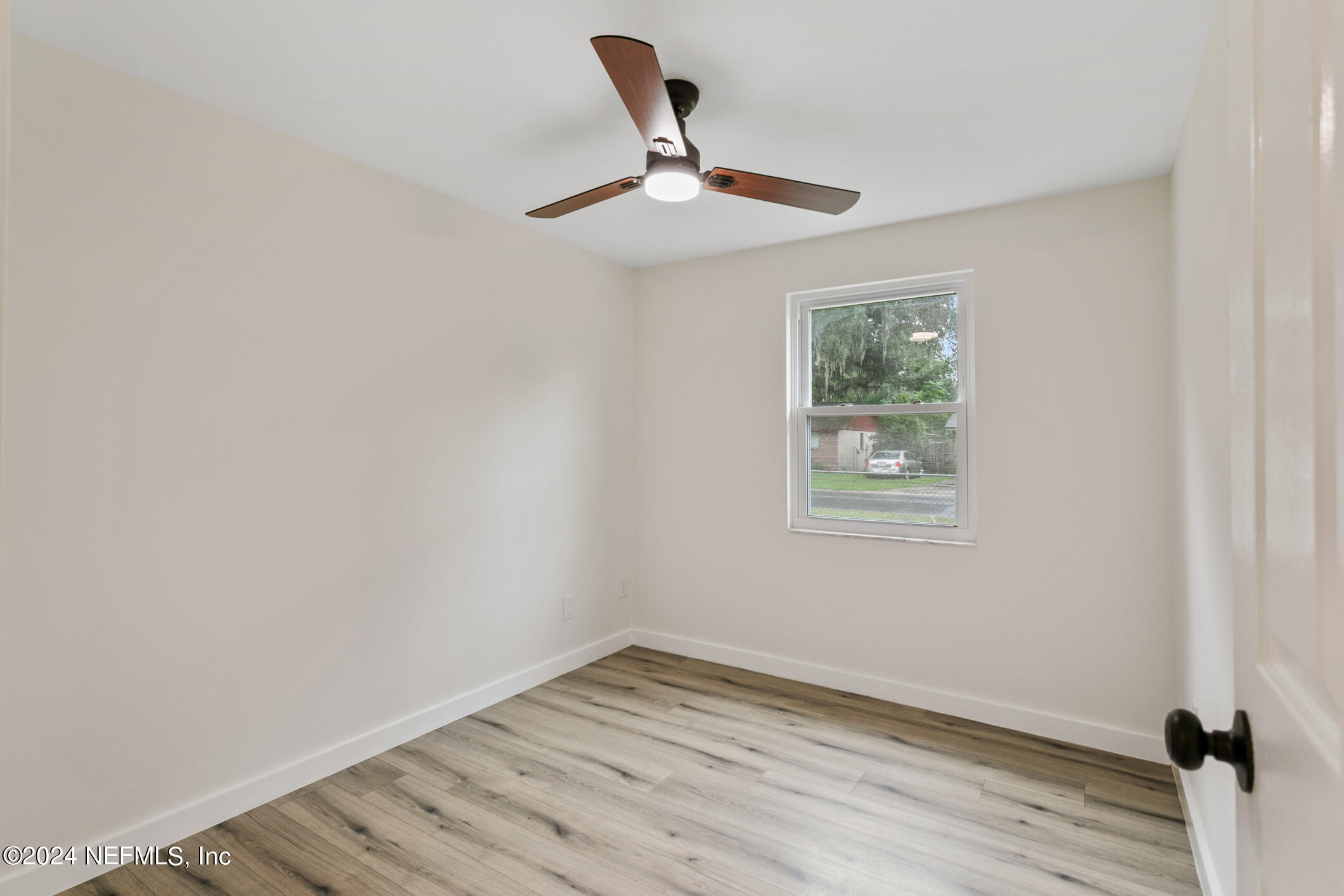 4216 Oriely Drive Jacksonville, FL 32210 - Photo 25 of 36 a view of empty room with wooden floor
