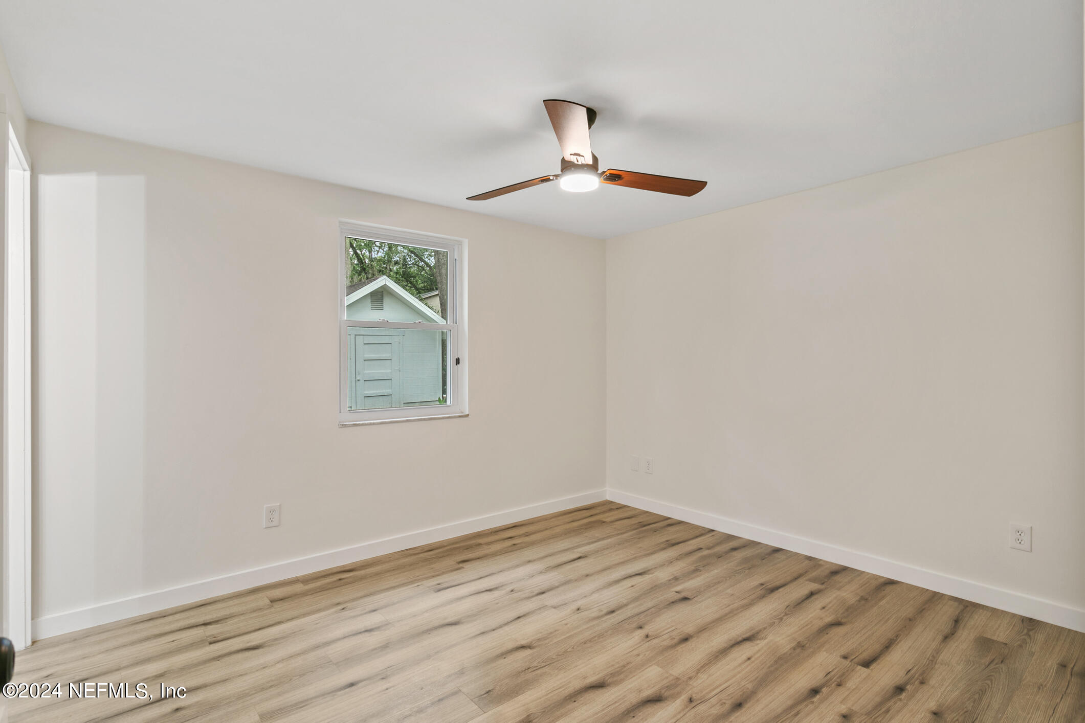 4216 Oriely Drive Jacksonville, FL 32210 - Photo 27 of 36 wooden floor in an empty room with a window