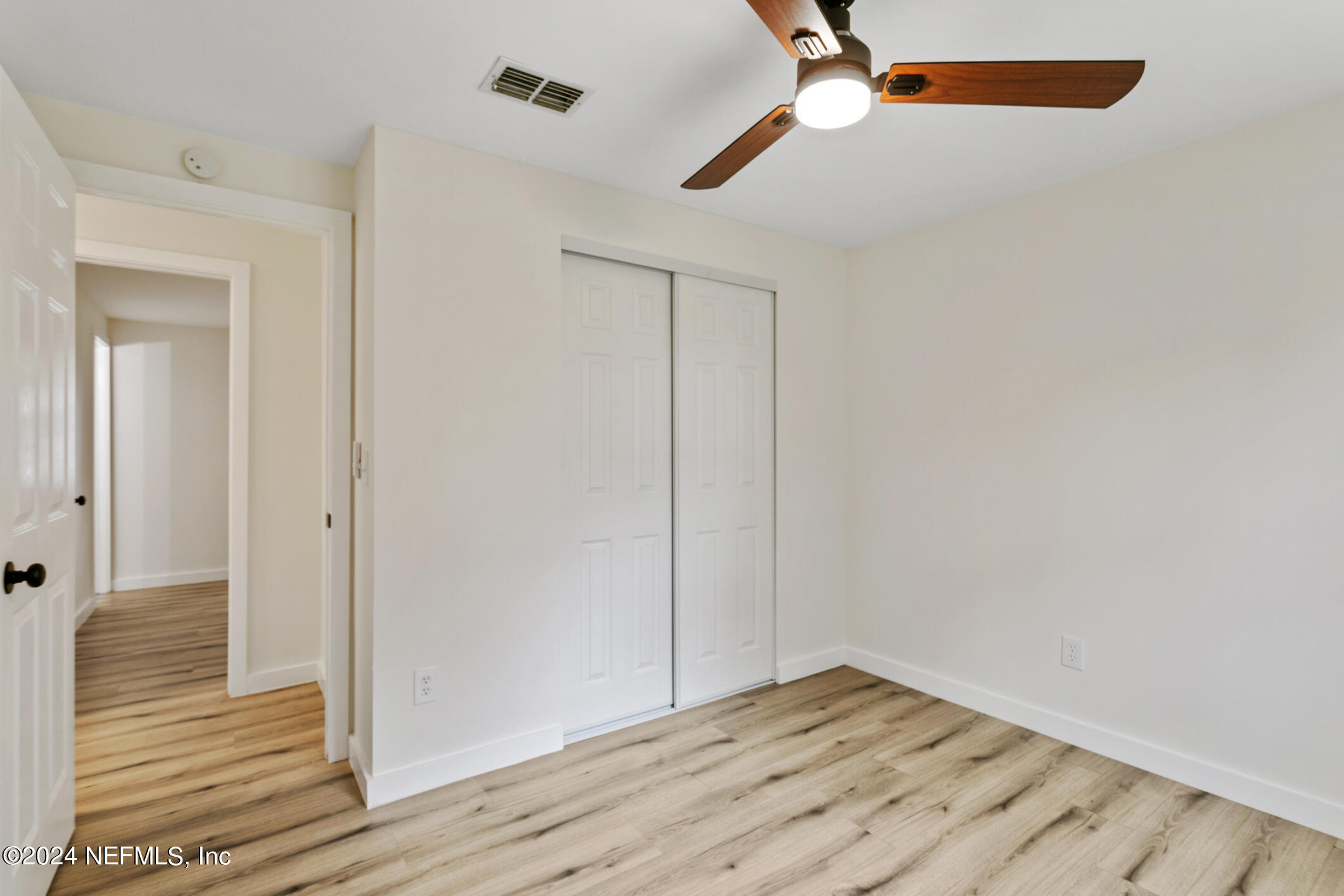 4216 Oriely Drive Jacksonville, FL 32210 - Photo 29 of 36 a view of hallway with wooden floor