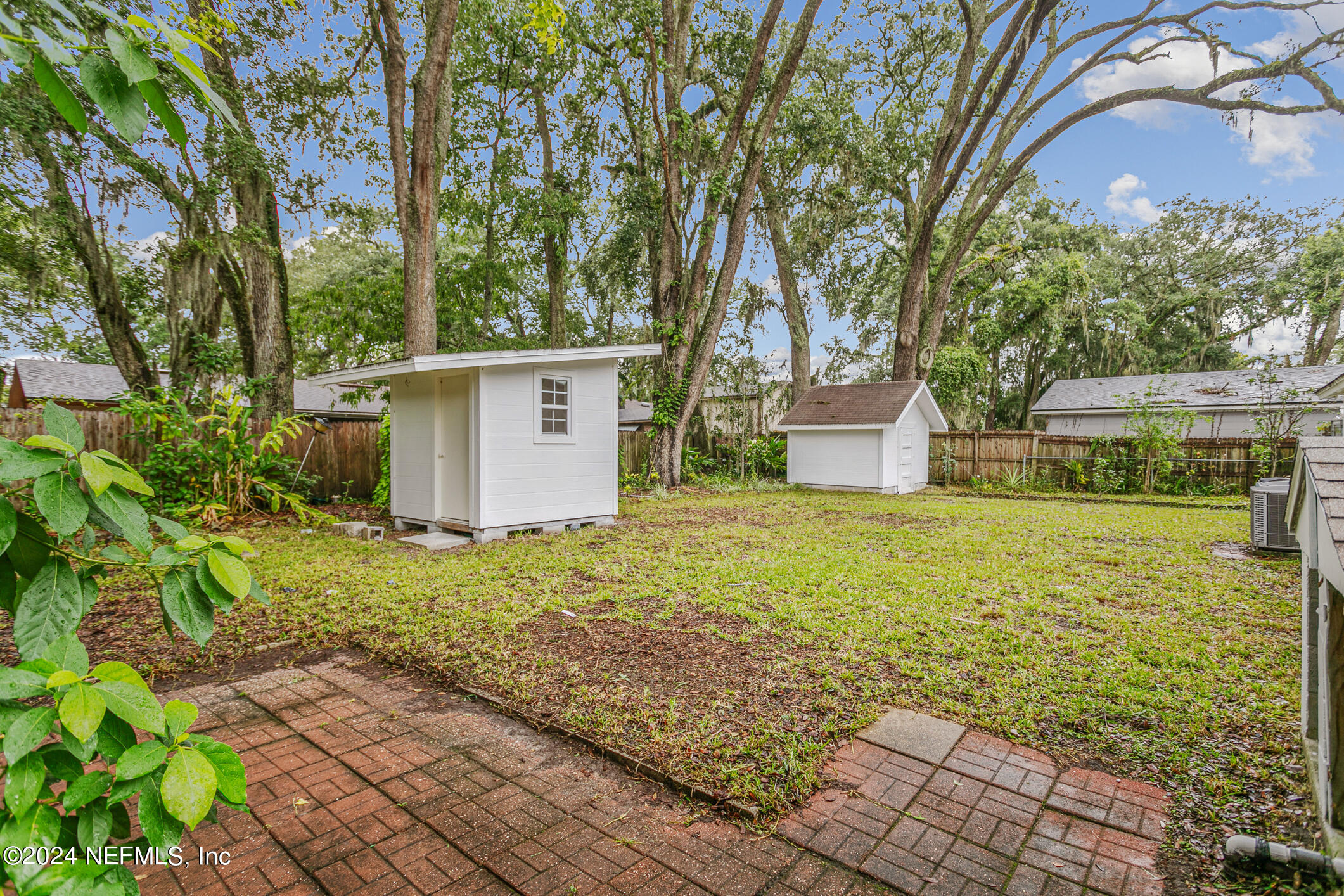 4216 Oriely Drive Jacksonville, FL 32210 - Photo 34 of 36 a backyard of a house with lots of green space