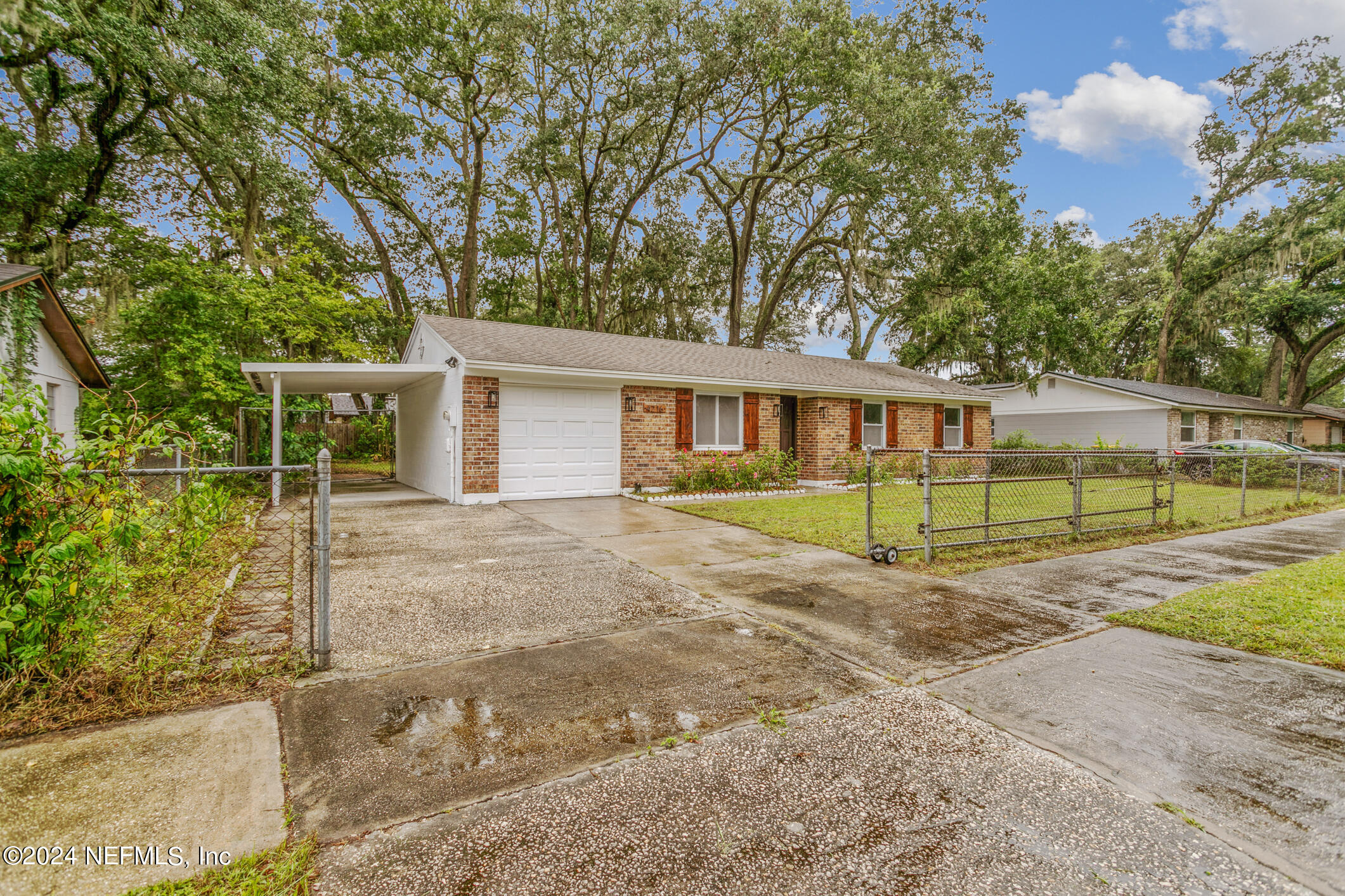 4216 Oriely Drive Jacksonville, FL 32210 - Photo 7 of 36 front view of a house with a yard