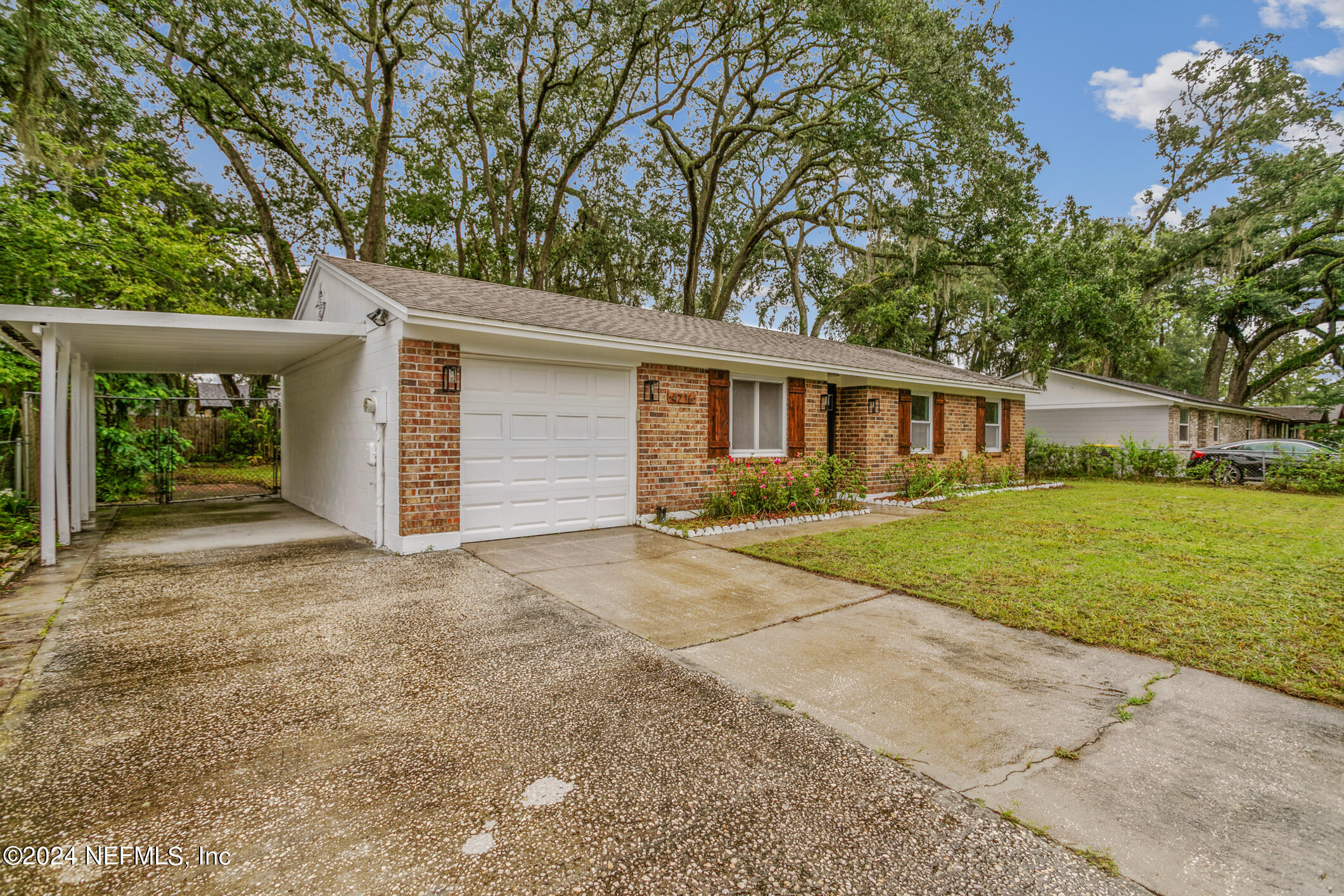 4216 Oriely Drive Jacksonville, FL 32210 - Photo 10 of 36 front view of house with a yard