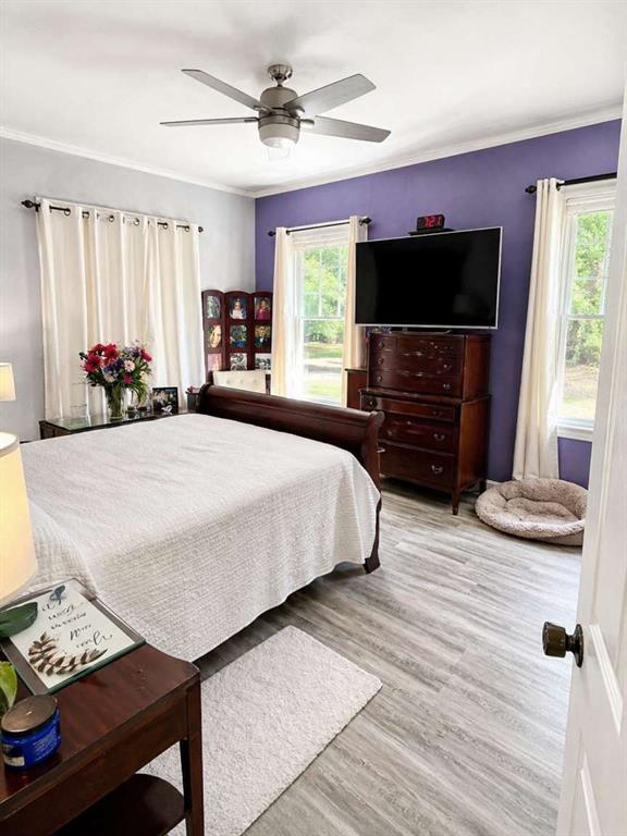 2405 Meriwether Road Shreveport, LA 71108 - Photo 9 of 20 a bedroom with a bed and a flat screen tv