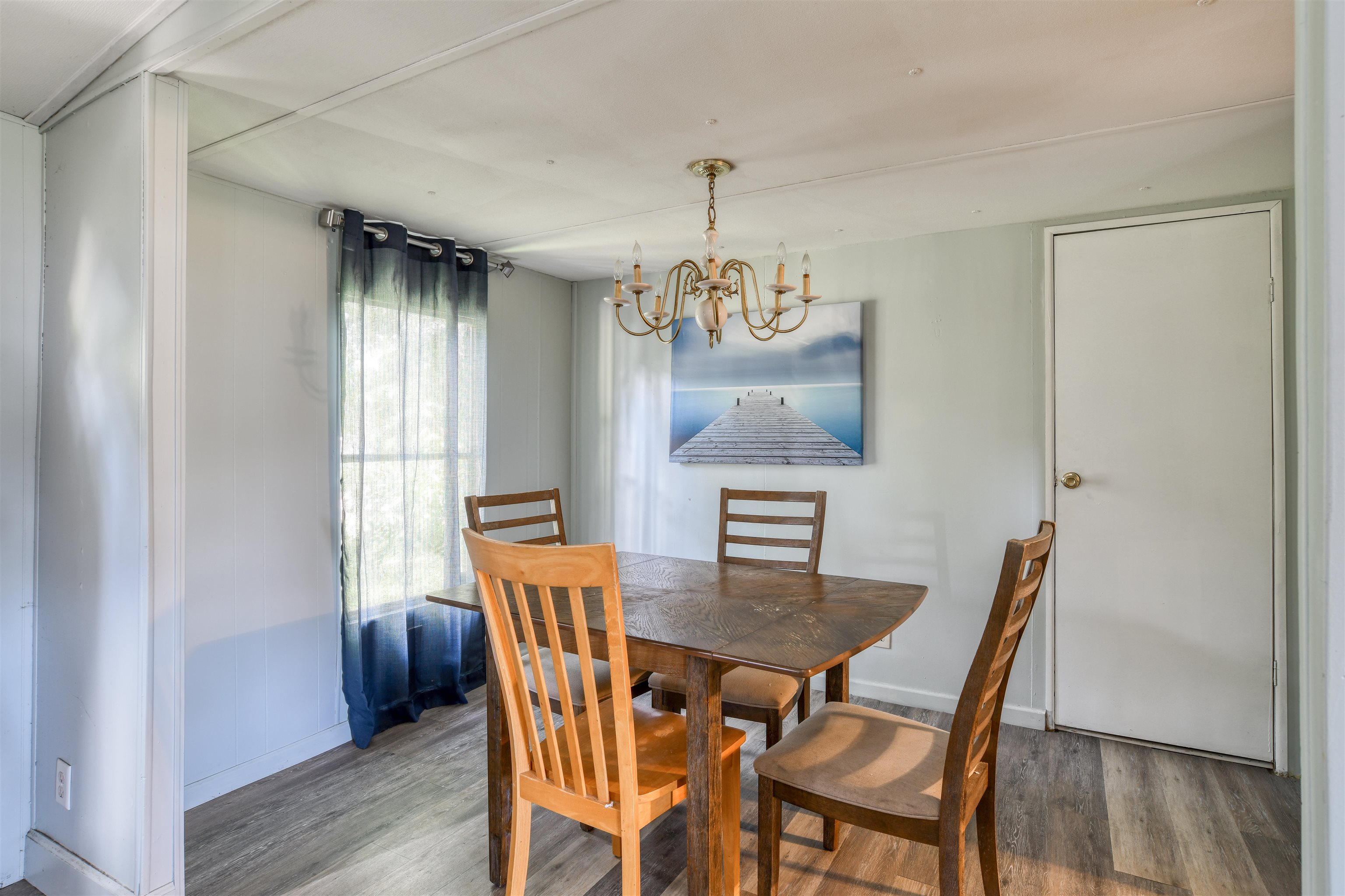 242 Basque Road St. Augustine, FL 32080 - Photo 11 of 20 a view of a dining room with furniture window and wooden floor