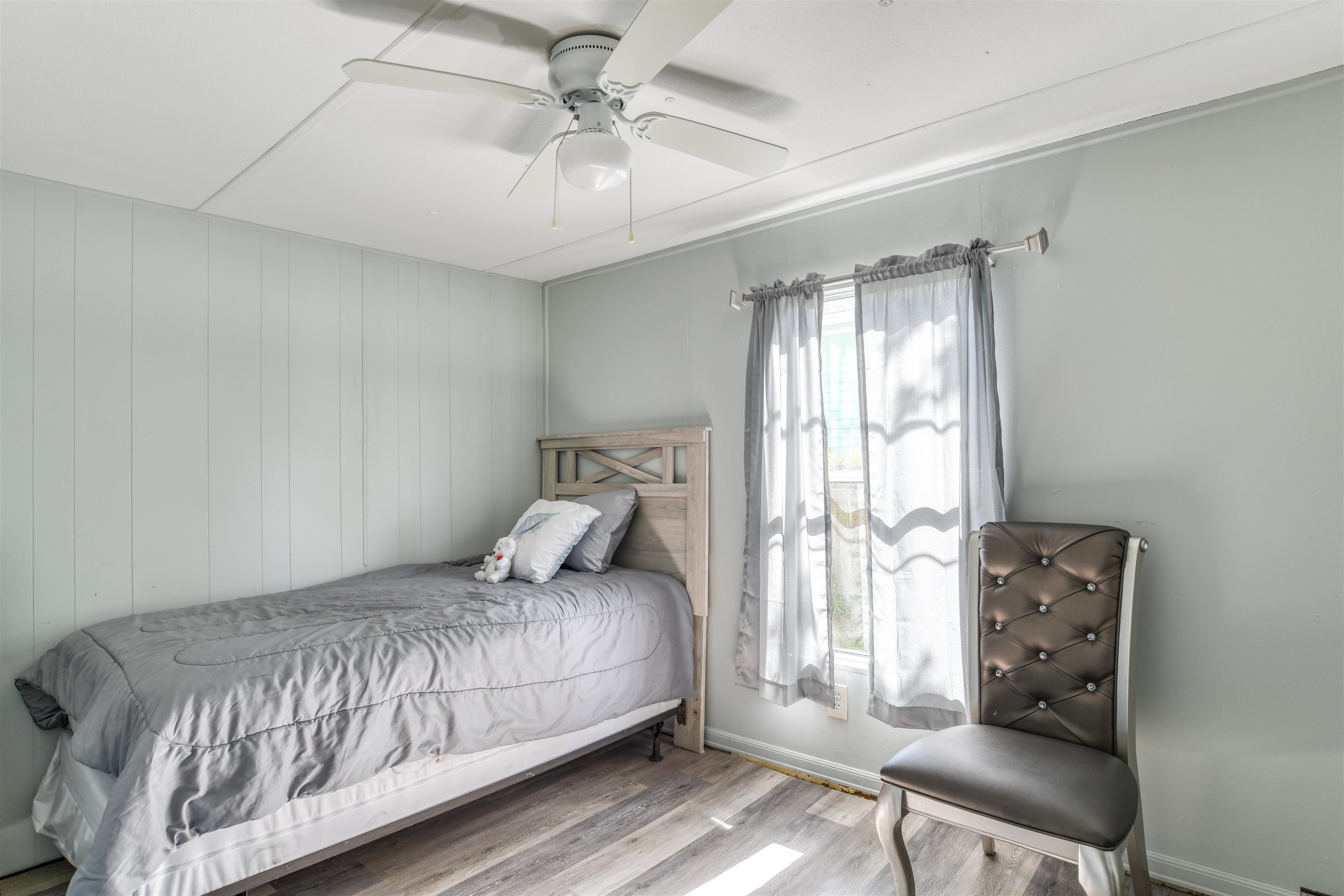 242 Basque Road St. Augustine, FL 32080 - Photo 15 of 20 a bedroom with a bed and wooden floor