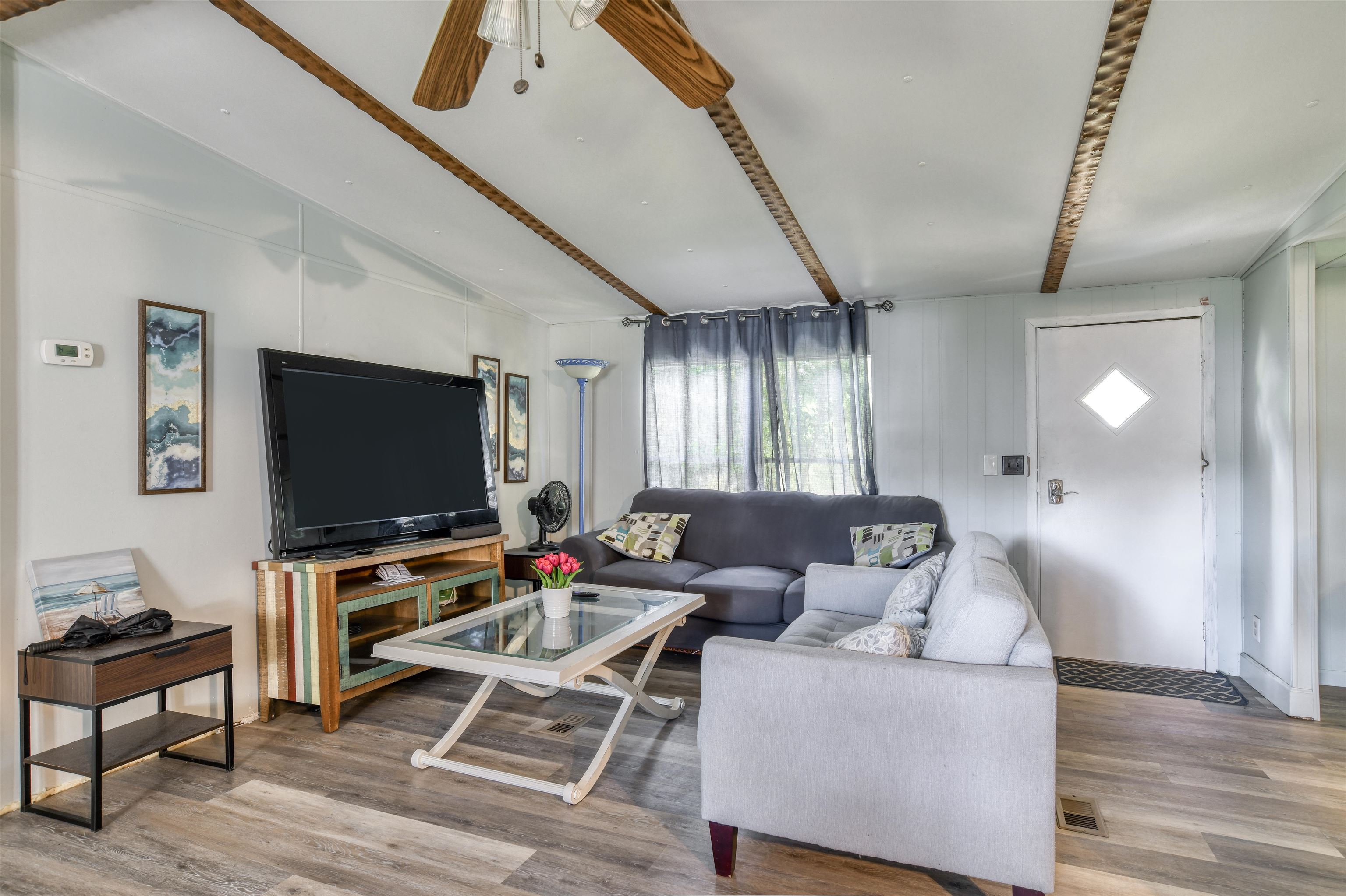242 Basque Road St. Augustine, FL 32080 - Photo 7 of 20 a living room with furniture and a flat screen tv