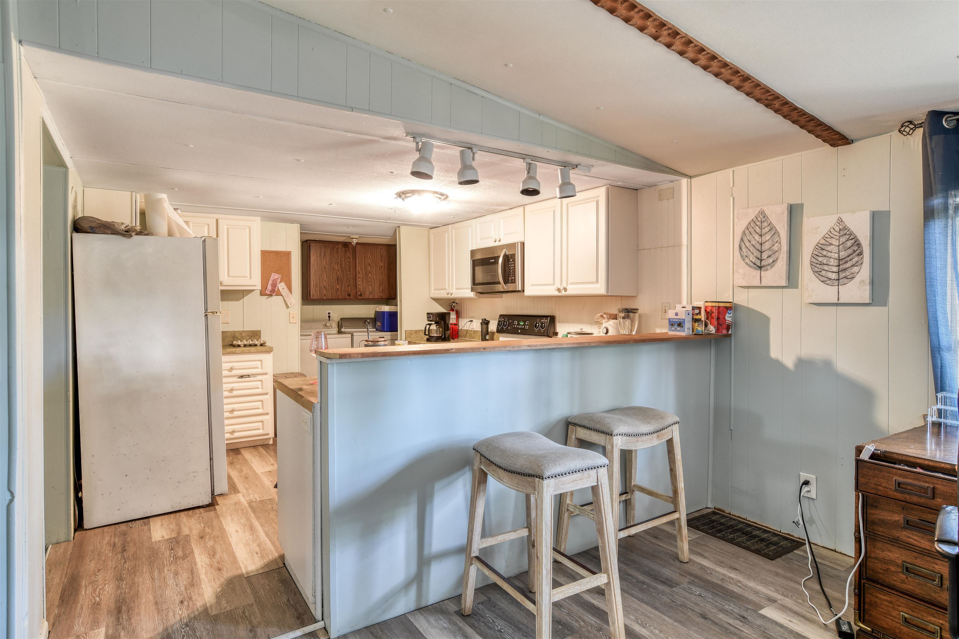 242 Basque Road St. Augustine, FL 32080 - Photo 9 of 20 a kitchen with stainless steel appliances granite countertop a refrigerator and a stove top oven