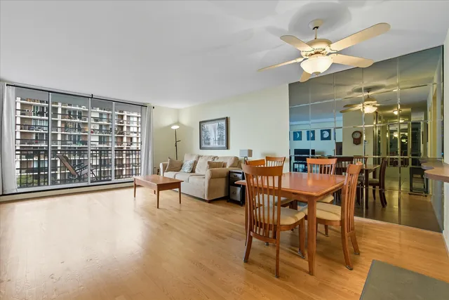 a view of a dining room with furniture window and wooden floor