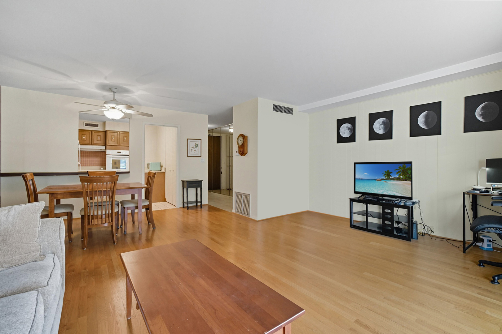 5855 North Sheridan Road, Unit 9F Chicago, IL 60660 - Photo 4 of 23 a living room with furniture and a flat screen tv