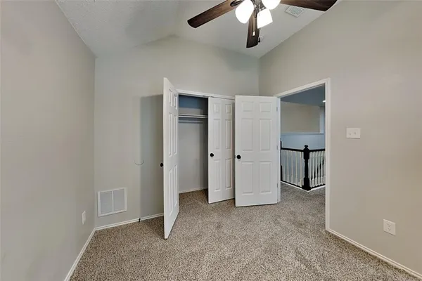 an empty room with fan