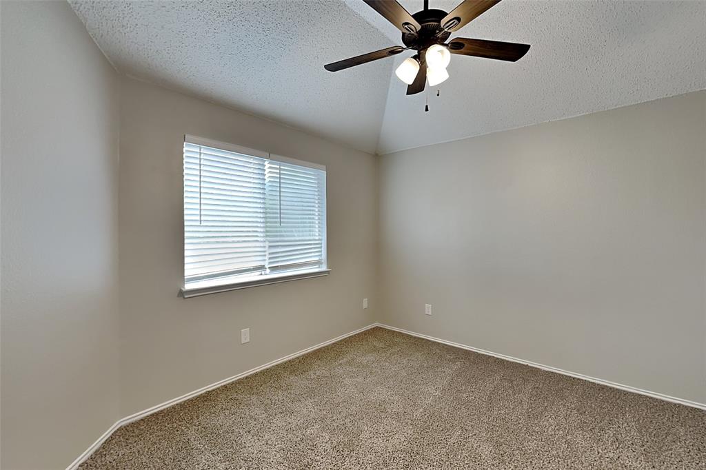 2224 Red Maple Road Flower Mound, TX 75022 - Photo 16 of 22 an empty room with a window and a fan