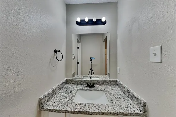 a view of a hallway with a chandelier