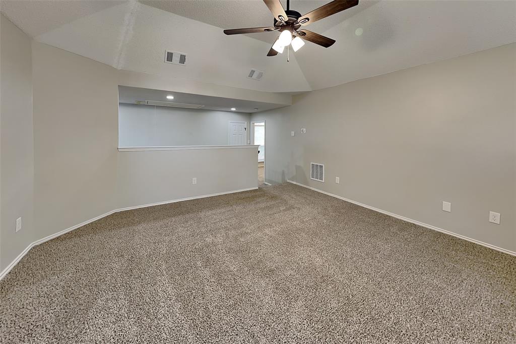 2224 Red Maple Road Flower Mound, TX 75022 - Photo 19 of 22 an empty room with a ceiling fan and window