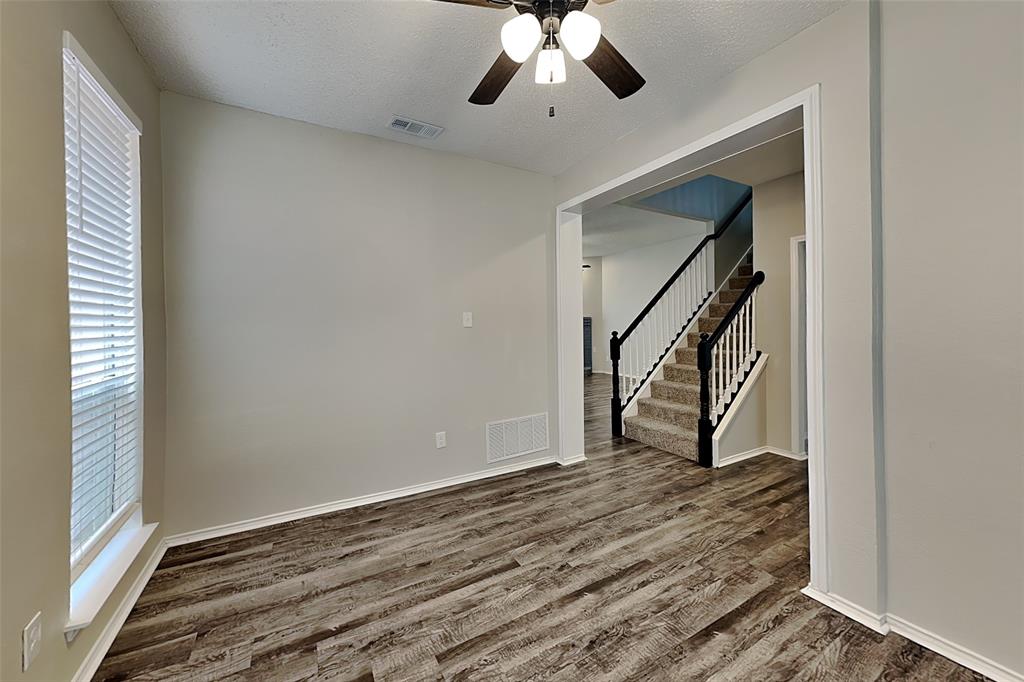 2224 Red Maple Road Flower Mound, TX 75022 - Photo 6 of 22 a view of an empty room with wooden floor and a window