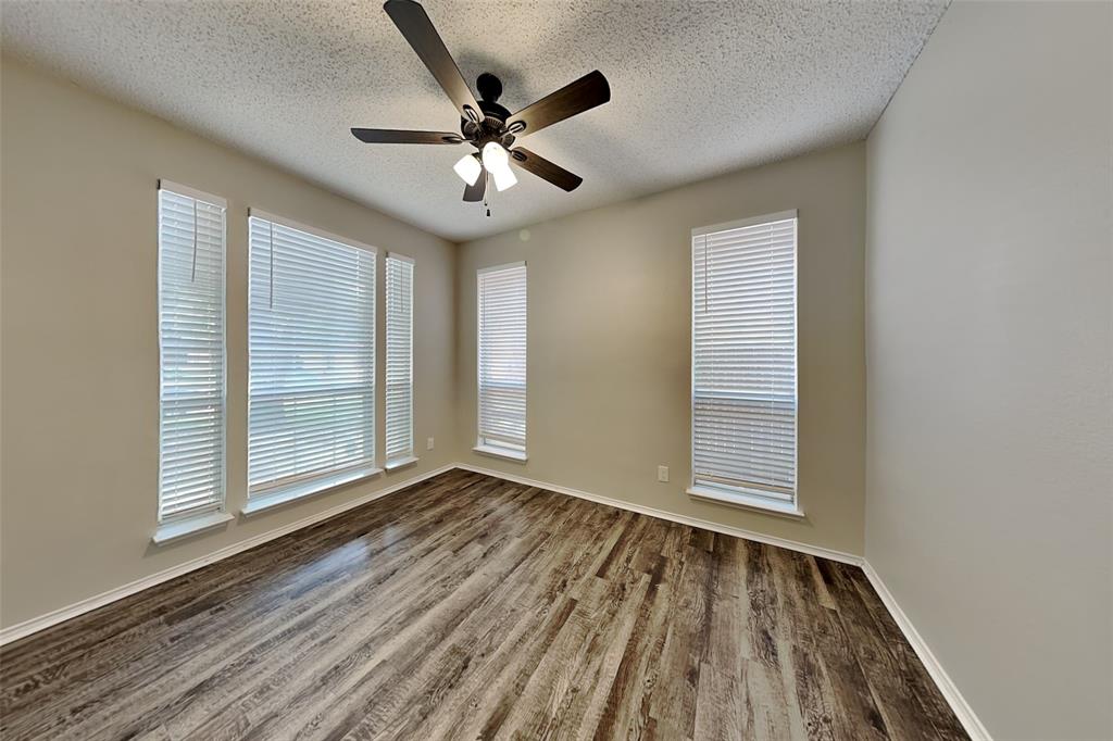 2224 Red Maple Road Flower Mound, TX 75022 - Photo 7 of 22 a view of an empty room with wooden floor and a window