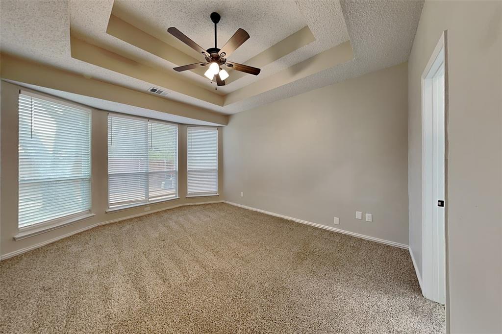 2224 Red Maple Road Flower Mound, TX 75022 - Photo 9 of 22 a view of an empty room with a chandelier fan