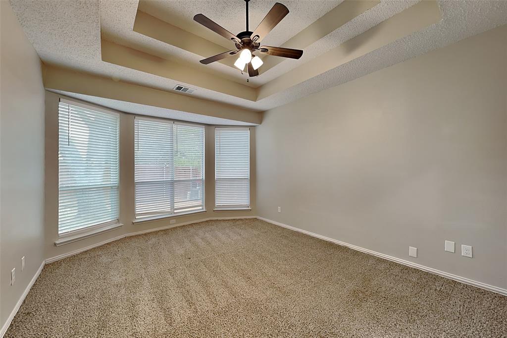 2224 Red Maple Road Flower Mound, TX 75022 - Photo 10 of 22 an empty room with chandelier fan and windows