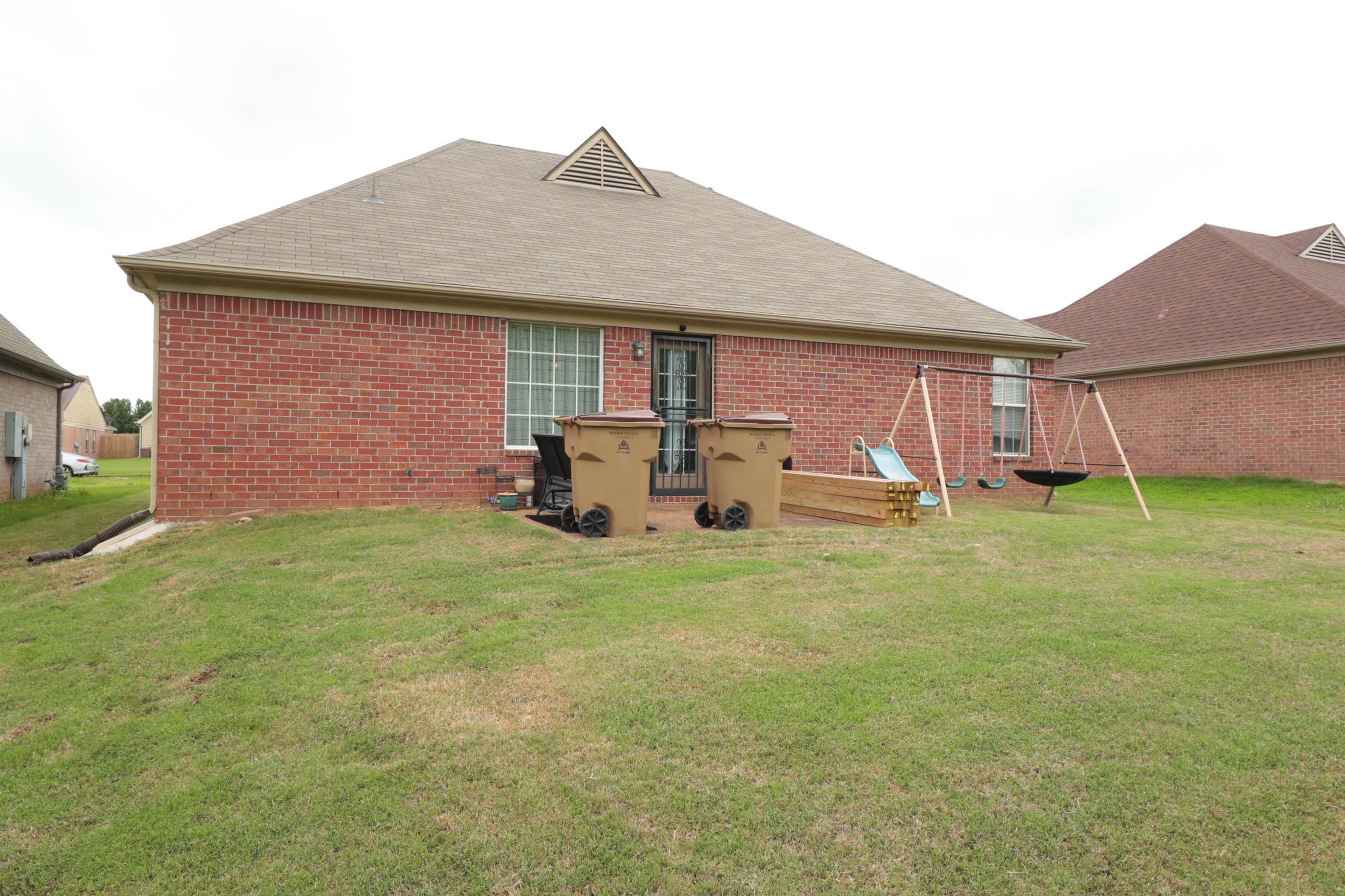 6916 Manslick Road Cordova, TN 38018 - Photo 15 of 17 a front view of house with yard and porch