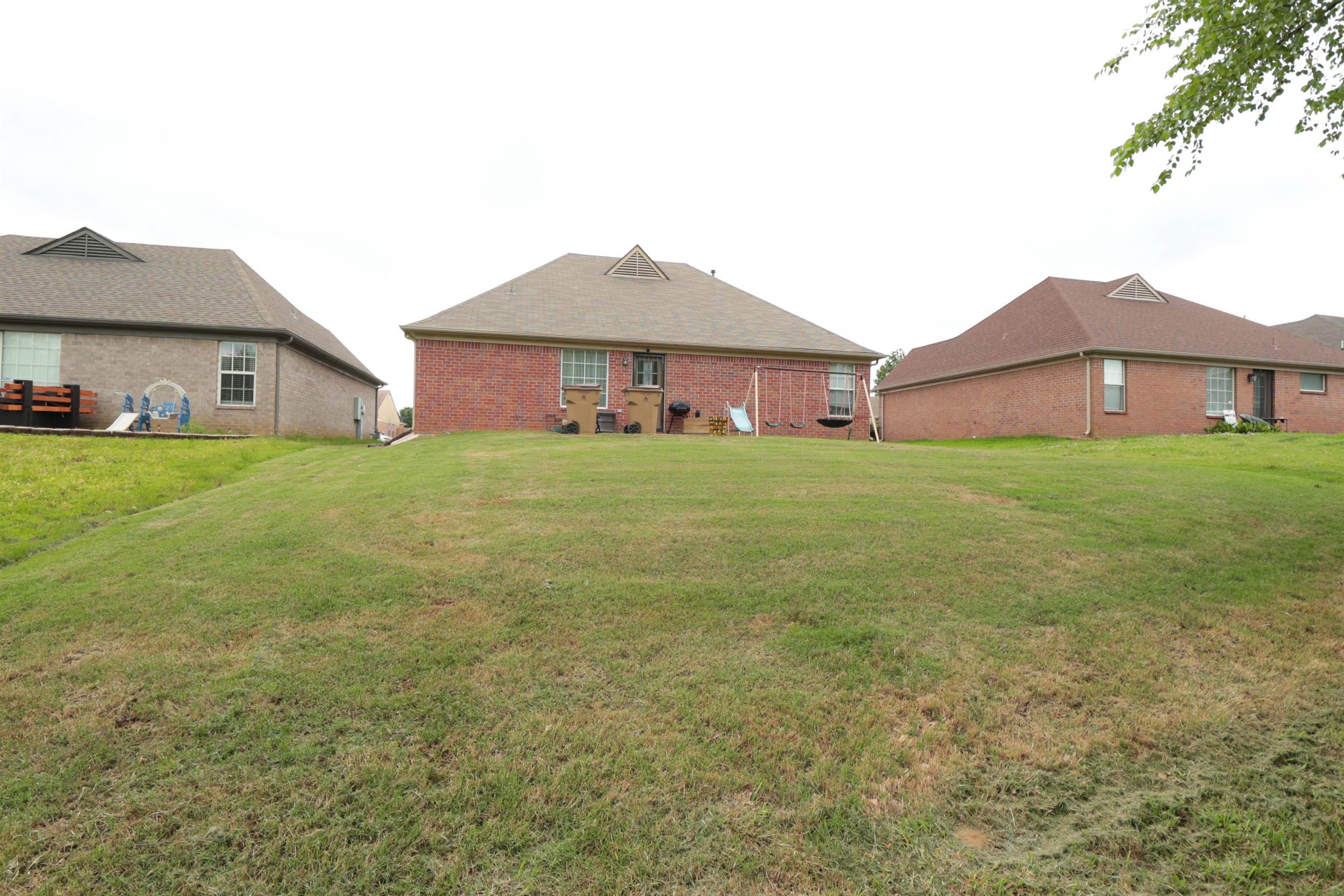 6916 Manslick Road Cordova, TN 38018 - Photo 16 of 17 a house view with a garden space