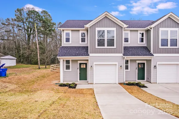 a front view of a house with yard