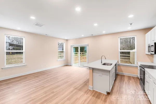 a view of a room with a sink and a window