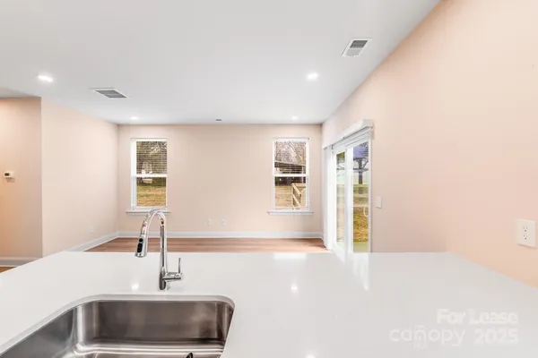 a kitchen with a sink and a refrigerator