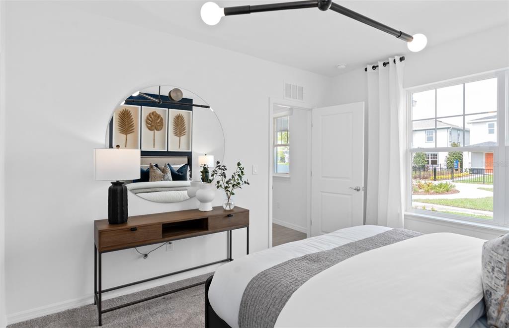 10382 Evening Horizon Street Orlando, FL 32829 - Photo 19 of 26 a bedroom with a bed and a window