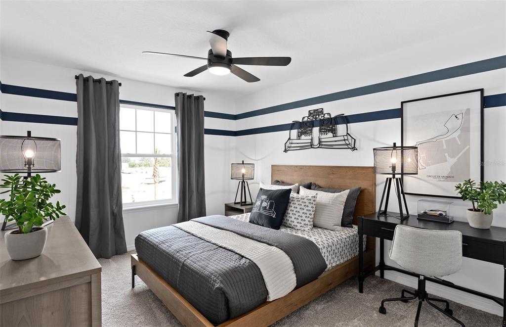 10382 Evening Horizon Street Orlando, FL 32829 - Photo 21 of 26 a bedroom with a bed and a potted plant