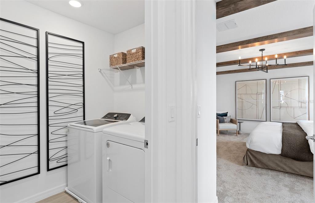 10382 Evening Horizon Street Orlando, FL 32829 - Photo 26 of 26 a bedroom with a bed and a mirror