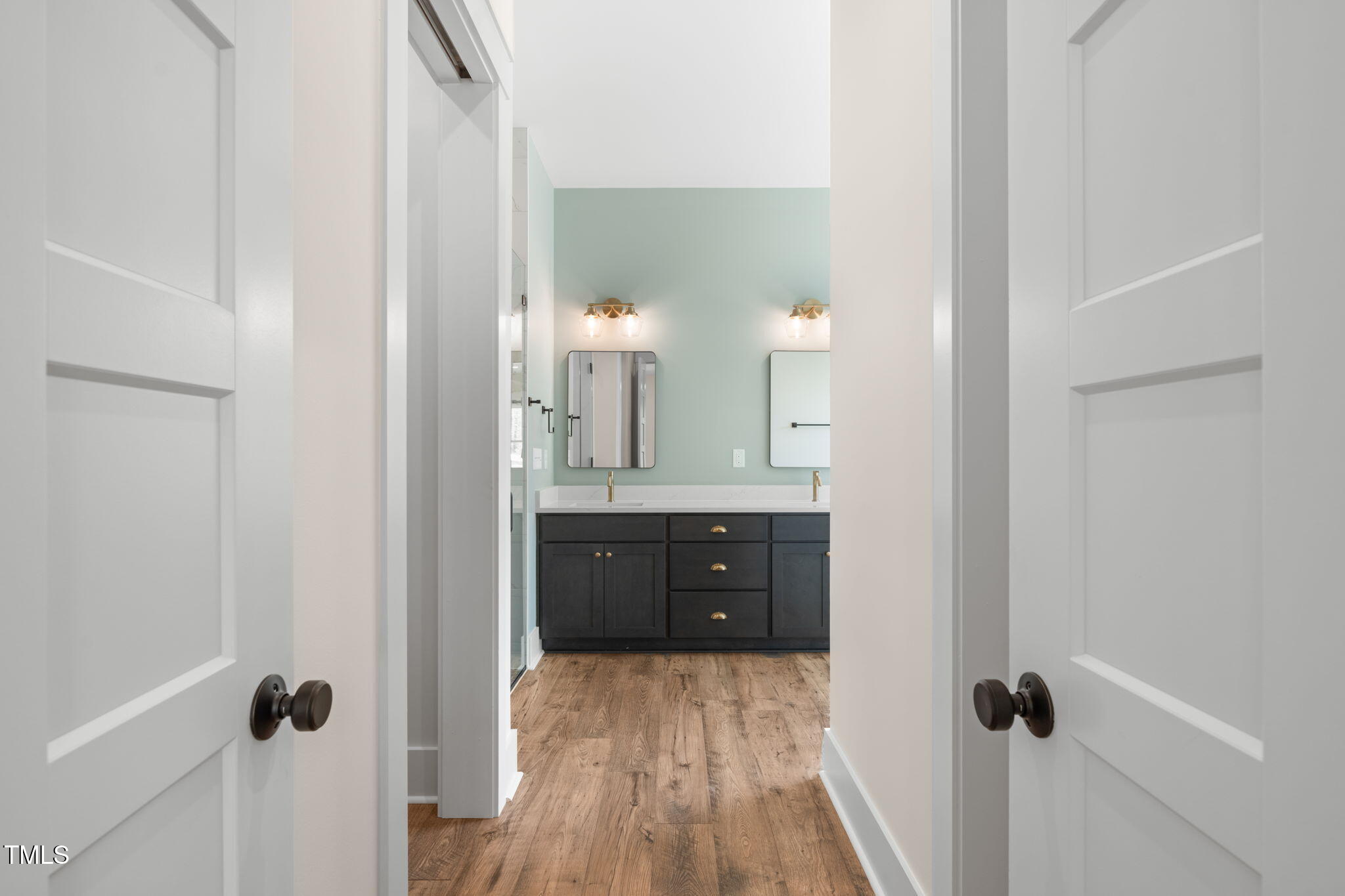 250 Pilot Ridge Road Zebulon, NC 27597 - Photo 19 of 43 a bathroom with a double vanity sink and mirror