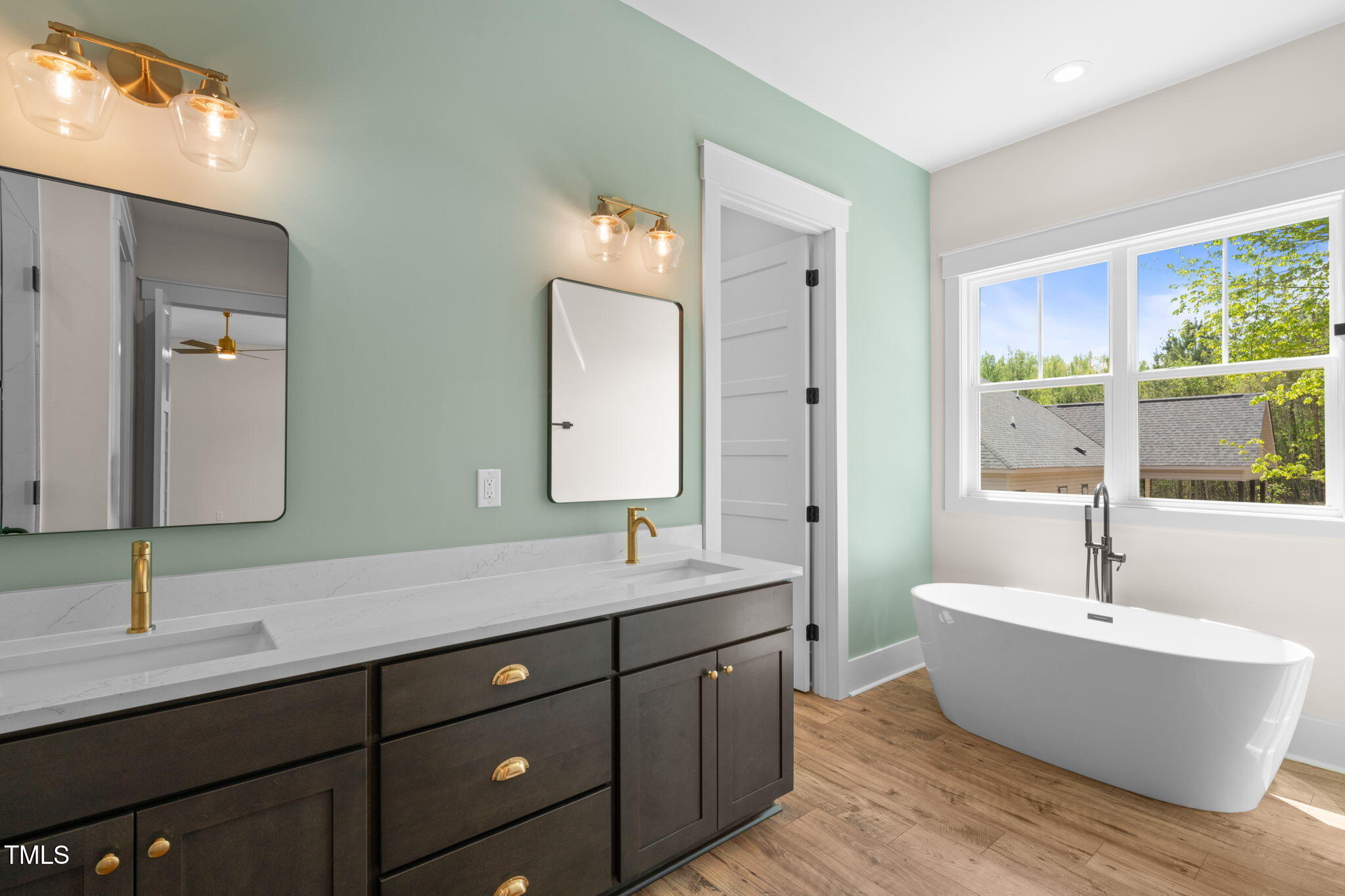 250 Pilot Ridge Road Zebulon, NC 27597 - Photo 20 of 43 a bathroom with a tub double sink and mirror