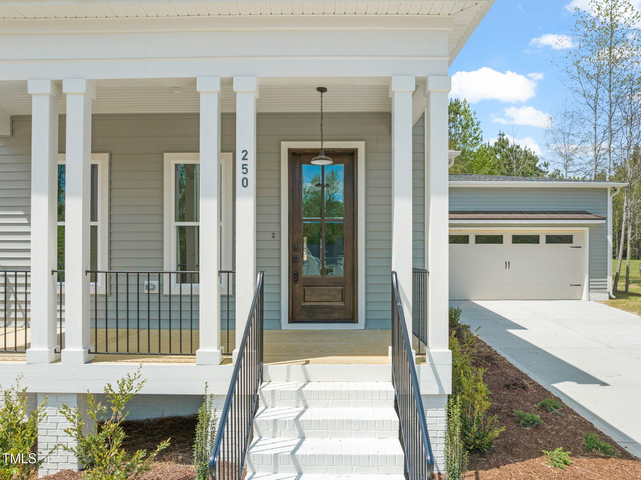 250 Pilot Ridge Road Zebulon, NC 27597 - Photo 2 of 43 a front view of a house with a porch