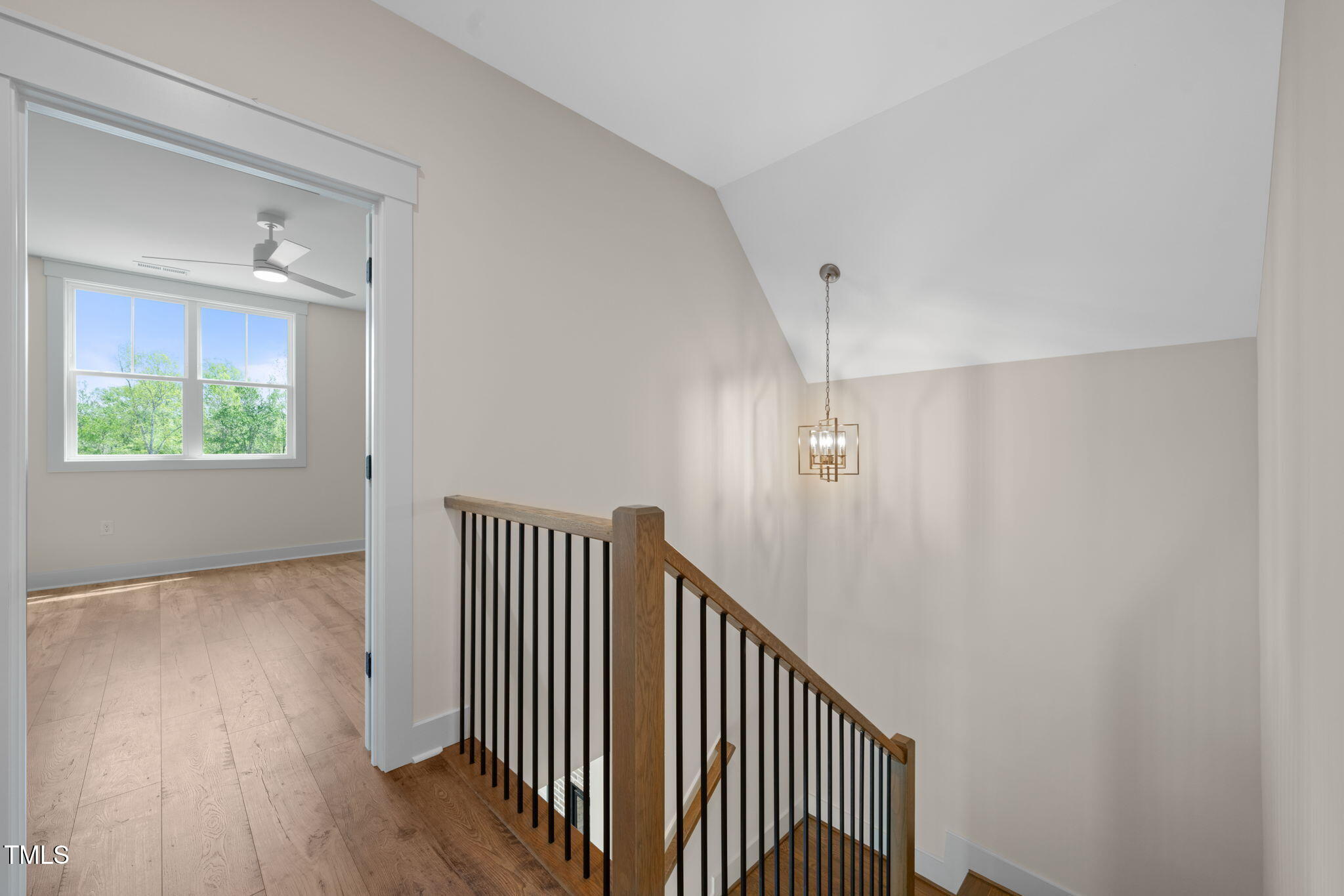 250 Pilot Ridge Road Zebulon, NC 27597 - Photo 24 of 43 a view of a hallway with entryway to wooden floor and staircase
