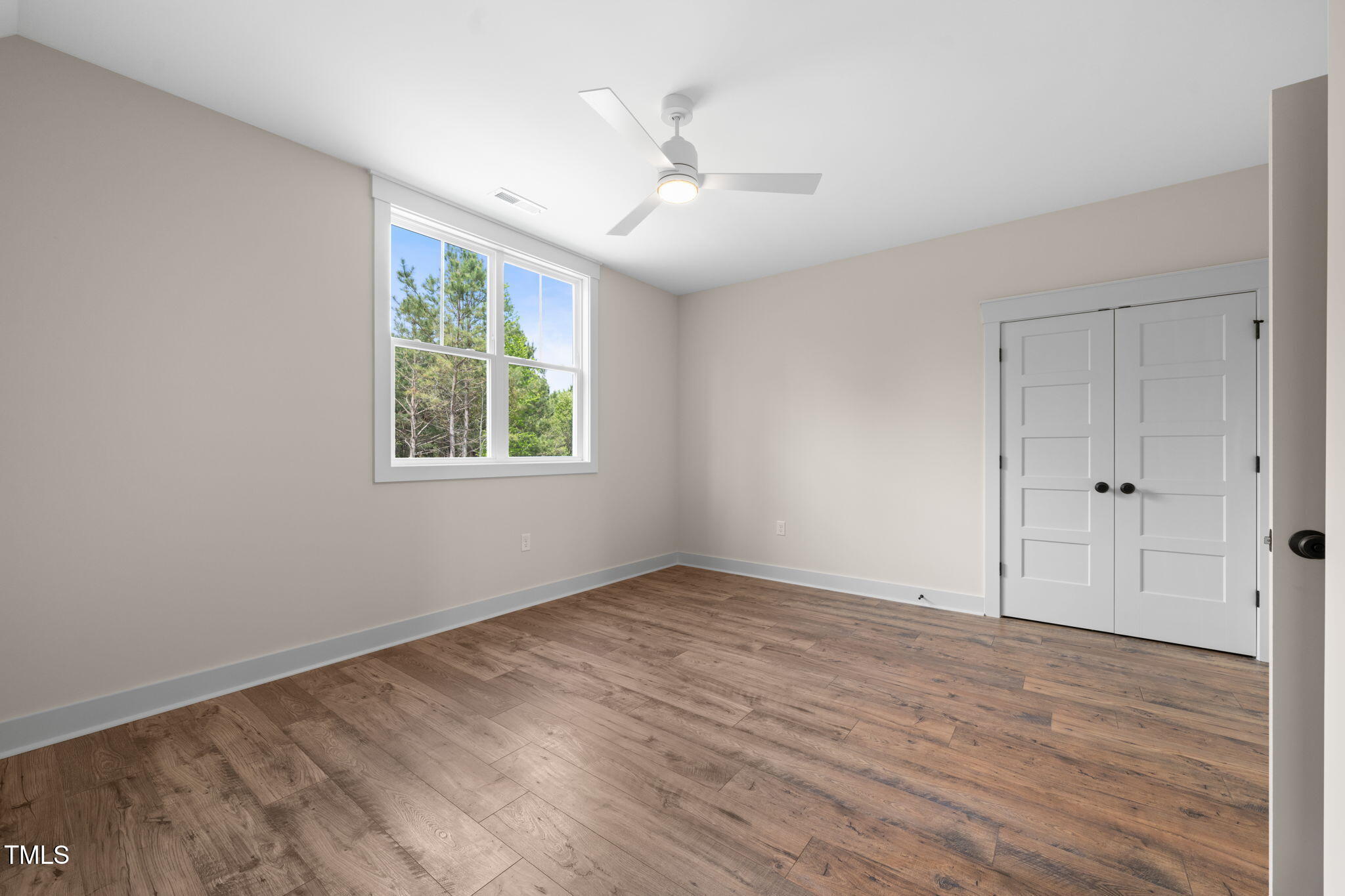 250 Pilot Ridge Road Zebulon, NC 27597 - Photo 25 of 43 wooden floor in an empty room with a window
