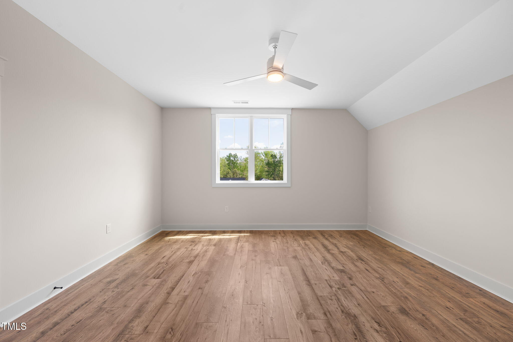 250 Pilot Ridge Road Zebulon, NC 27597 - Photo 29 of 43 wooden floor in an empty room with a window