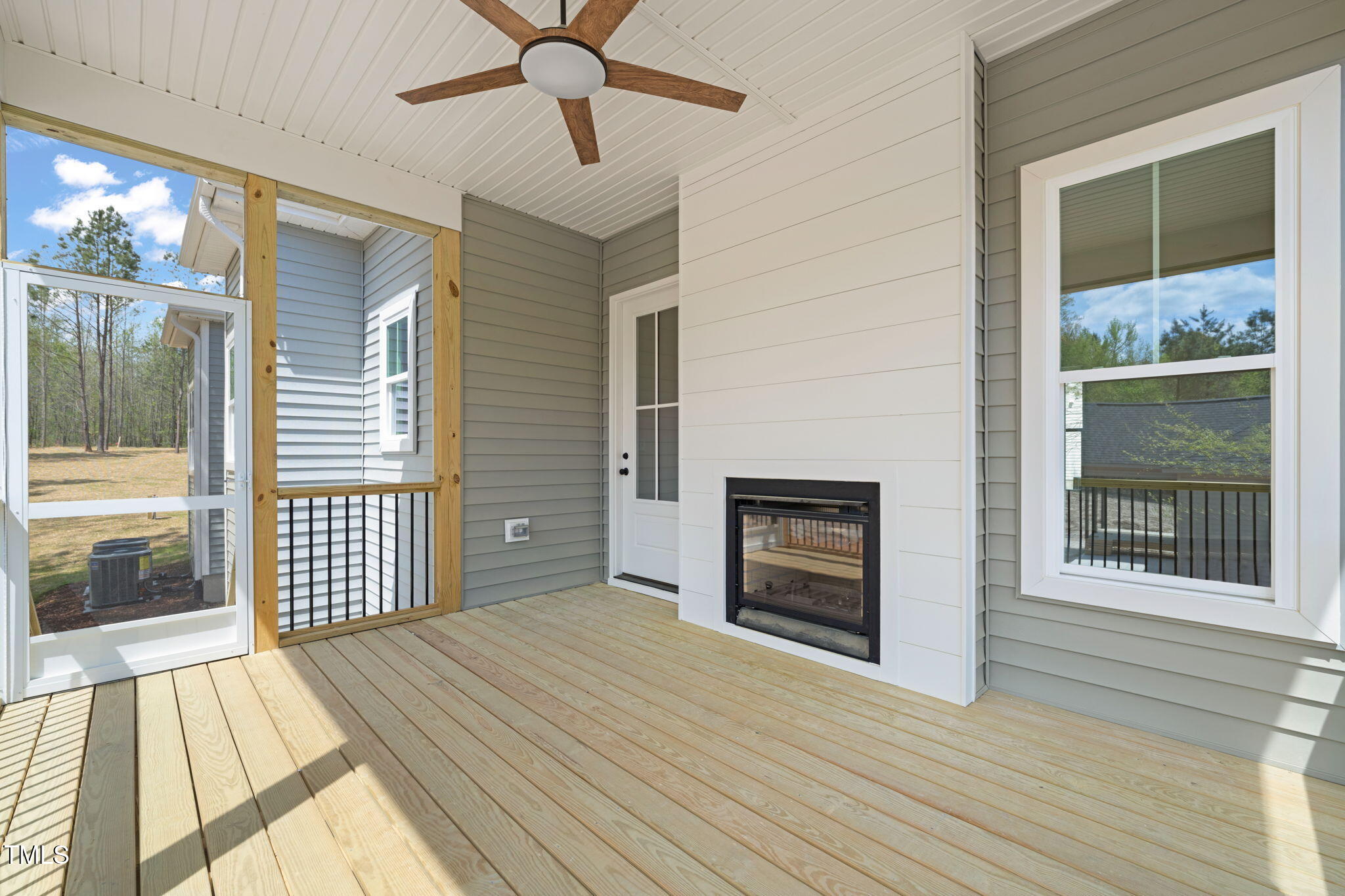 250 Pilot Ridge Road Zebulon, NC 27597 - Photo 32 of 43 a view of a livingroom with wooden floor and a fireplace