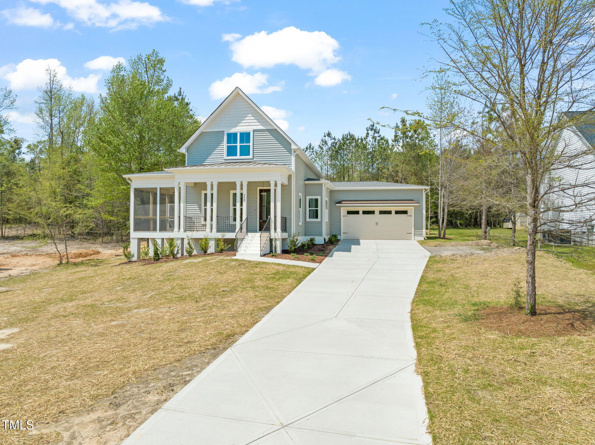 250 Pilot Ridge Road Zebulon, NC 27597 - Photo 39 of 43 a view of house with yard outdoor seating and covered with trees