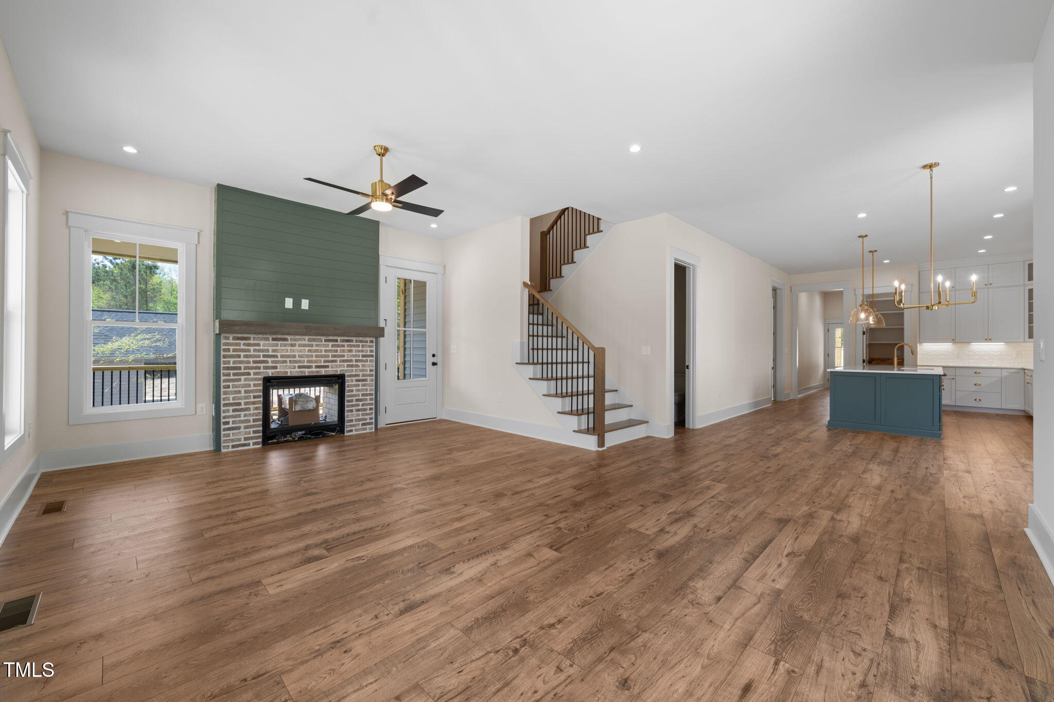 250 Pilot Ridge Road Zebulon, NC 27597 - Photo 5 of 43 a view of a room with wooden floor and a fireplace