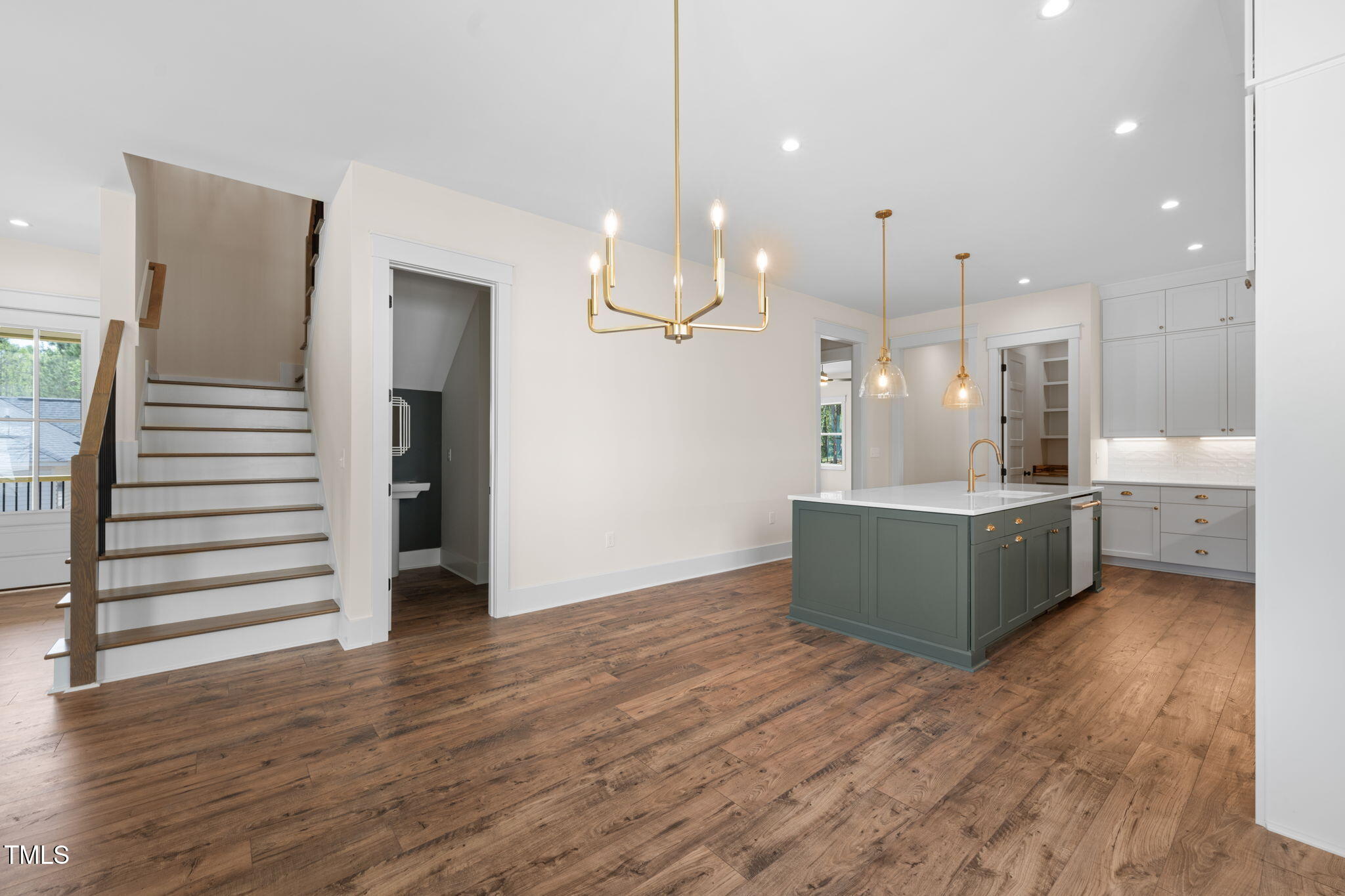 250 Pilot Ridge Road Zebulon, NC 27597 - Photo 8 of 43 a view of a kitchen with wooden floor and windows
