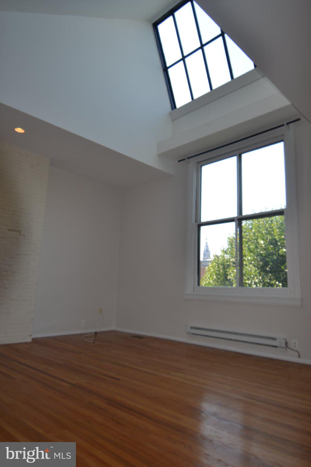 1010 Clinton Street, Unit 3M Philadelphia, PA 19107 - Photo 7 of 15 Bright, airy space with skylight charm.