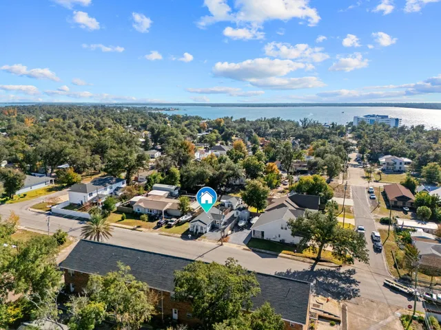 an aerial view of a houses with outdoor space