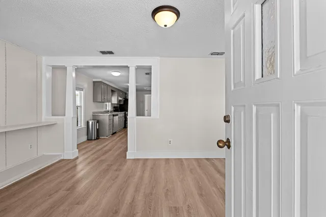 wooden floor with an entryway