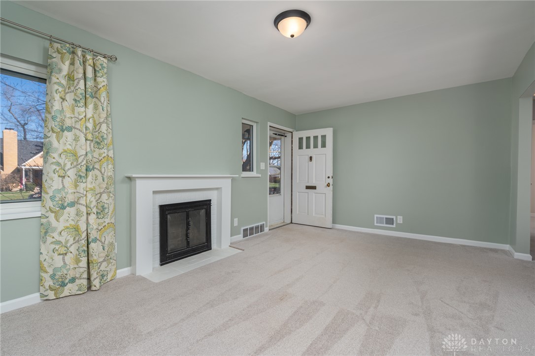 326 North Bromfield Road Kettering, OH 45429 - Photo 6 of 30 This inviting living area features a fireplace and abundant natural light.