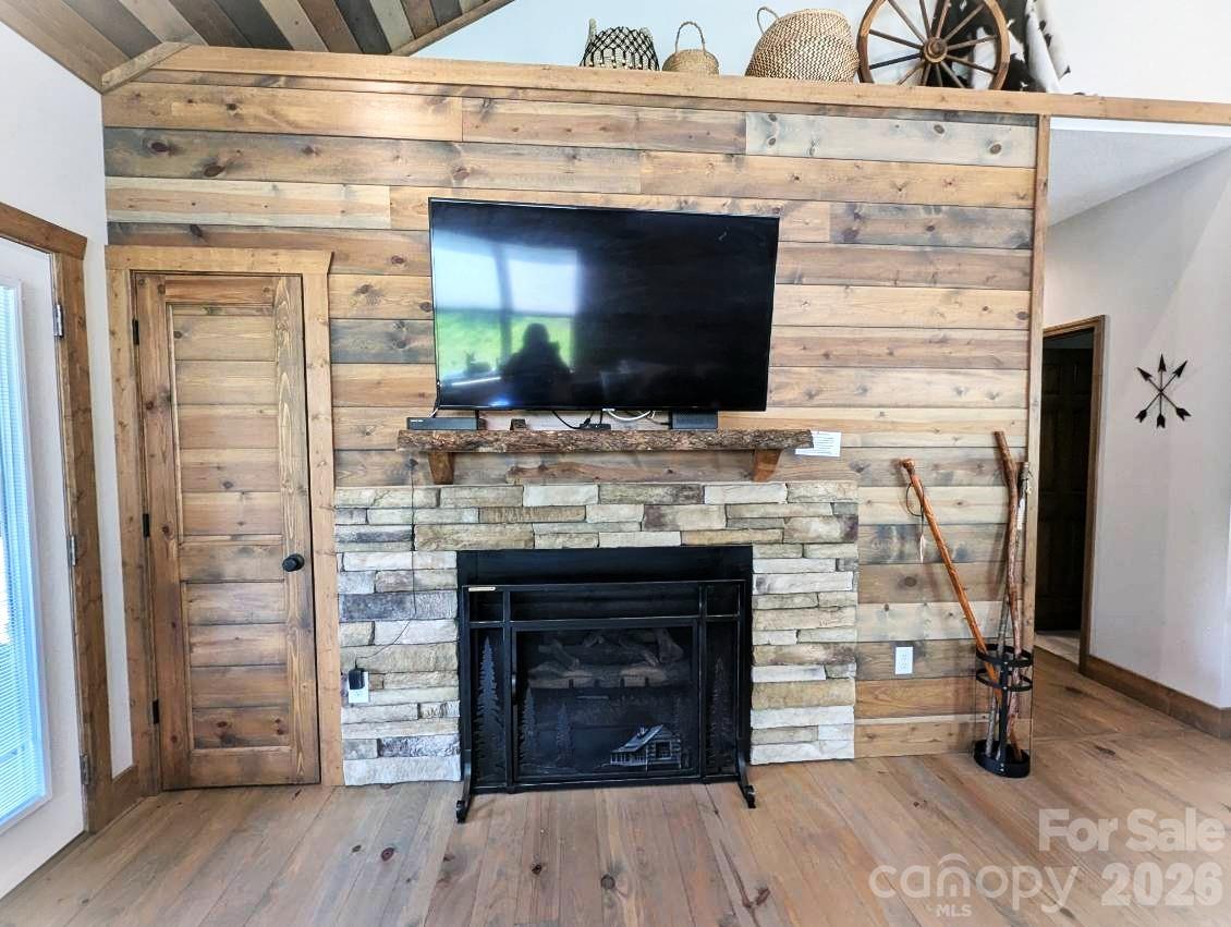 10 Rio Bravo Drive, Unit 4 Sylva, NC 28779 - Photo 18 of 33 a living room with a fireplace and a flat screen tv